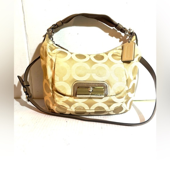 Coach Handbags - Coach vintage CC signature print canvas Tan crossbody Bag